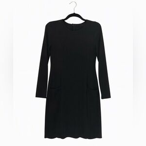 The Limited Size 4 Black Long-Sleeved Black Dress with Pleated Bottom.